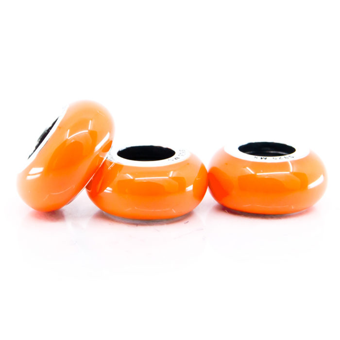 three orange enamel spacer