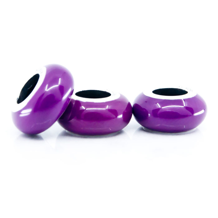 three purple enamel stoppers