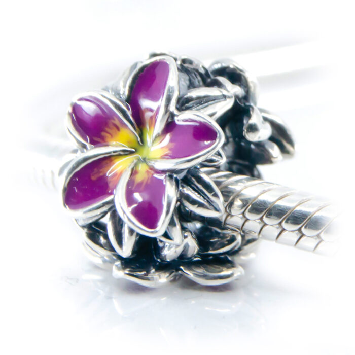 purple frangipani flower charm